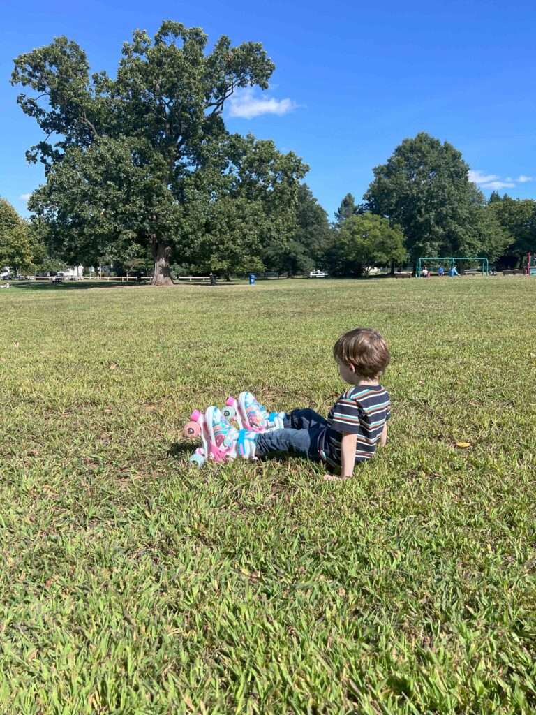 Nathan on grass field in skates