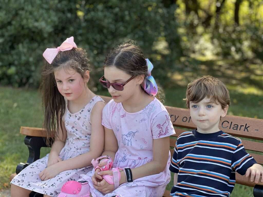 kids on park bench learning about gift trusts